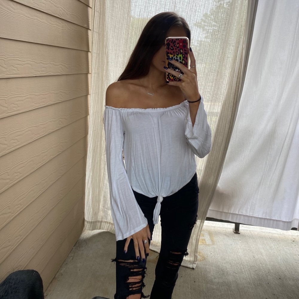 Off the shoulder white long sleeved blouse